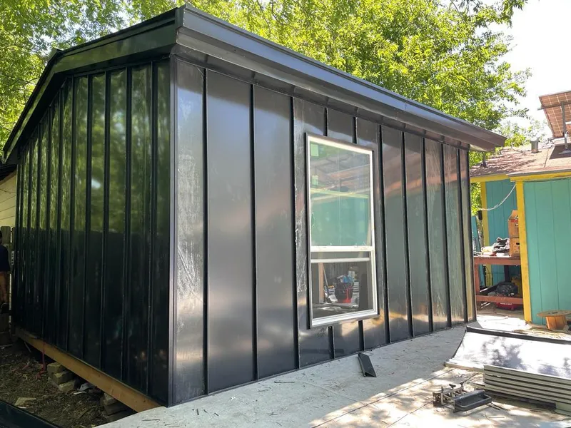 Black standing seam metal wall panels for Roof Inspection in Oronoko