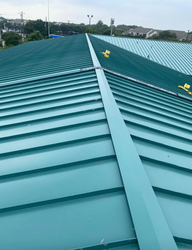 Green commercial metal roof ridge and valley for Metal Roof Repair in Oronoko